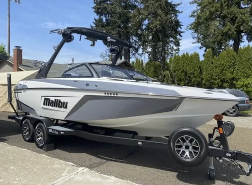 A Malibu wake boat on its trailer, detailed